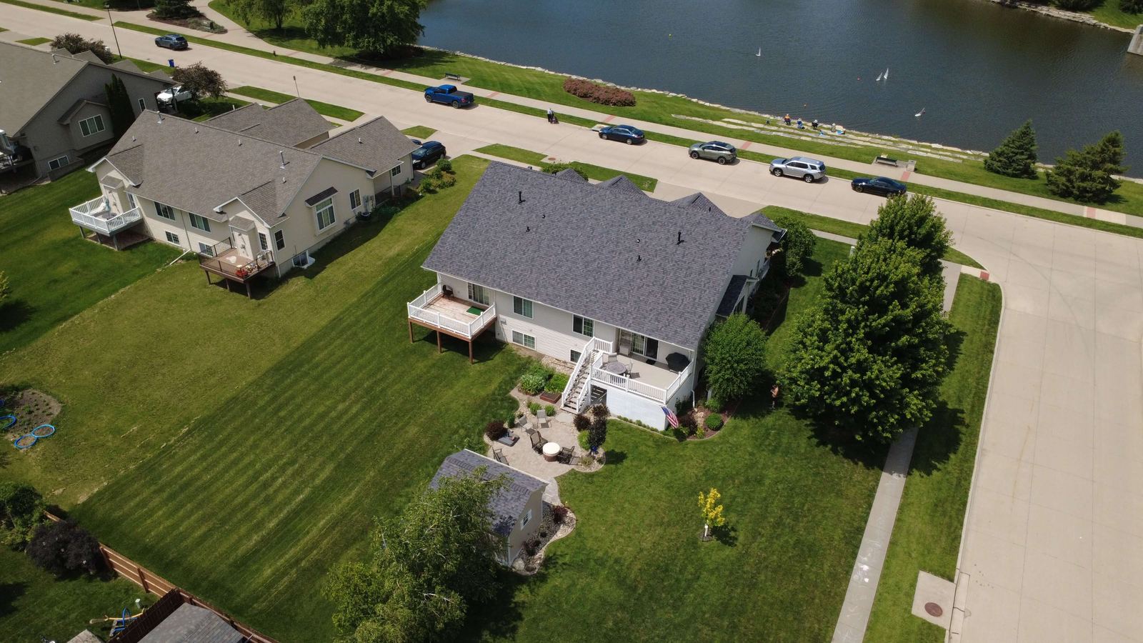 Lakefront home and finished roof, aerial drone photo