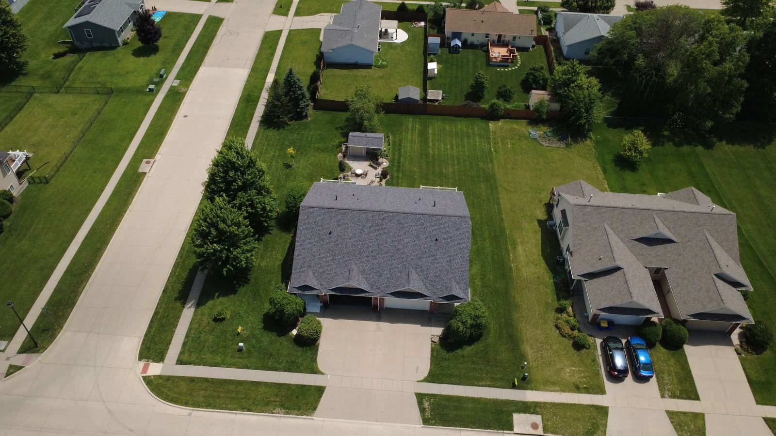 New roof from directly overhead showing clean shingle lines, drone photo