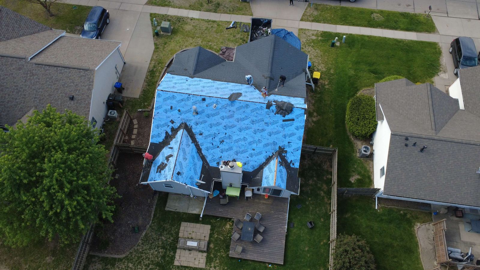Roof deck prepared with synthetic underlayment during replacement, aerial photo